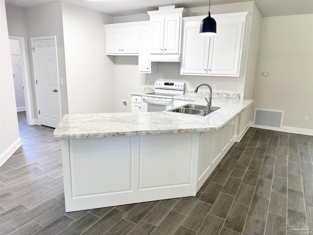 6283 Andys Ln, Milton, FL 32570 - kitchen featuring electric range, a sink, wood finish floors, and white cabinetry