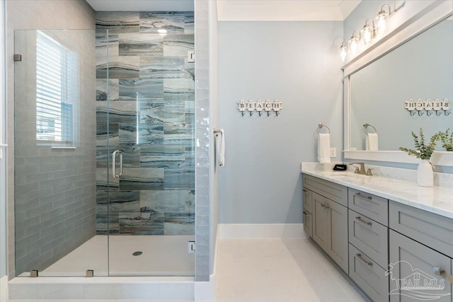 bathroom with tile patterned flooring, vanity, and an enclosed shower