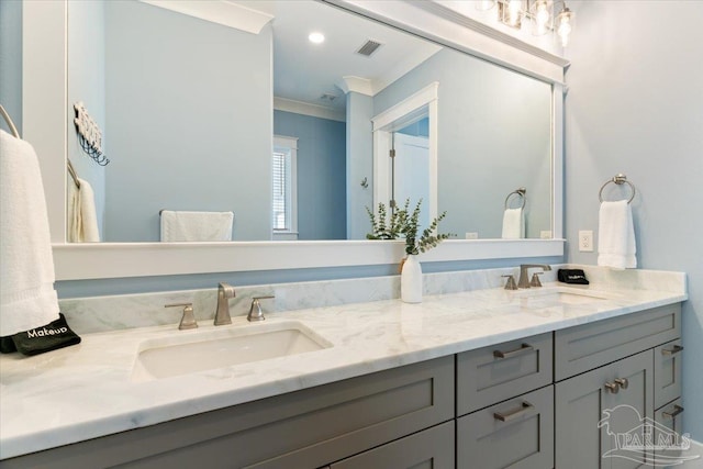 bathroom featuring vanity and crown molding