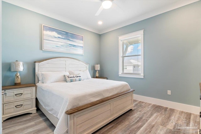 bedroom featuring light hardwood / wood-style floors and ceiling fan