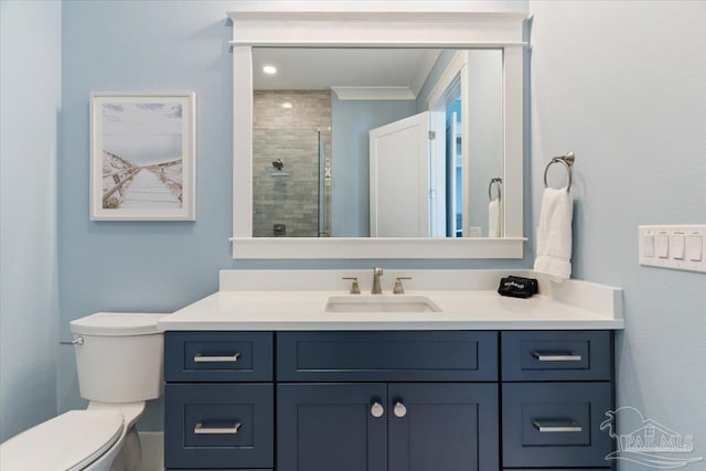 bathroom featuring vanity, an enclosed shower, and toilet