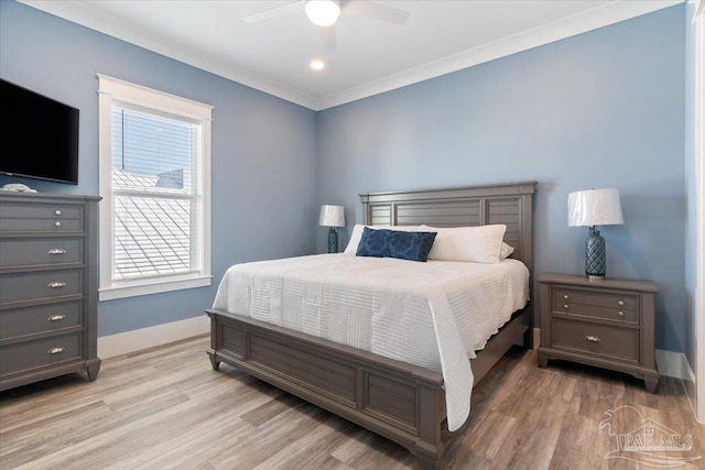 bedroom with ceiling fan, ornamental molding, and light hardwood / wood-style flooring