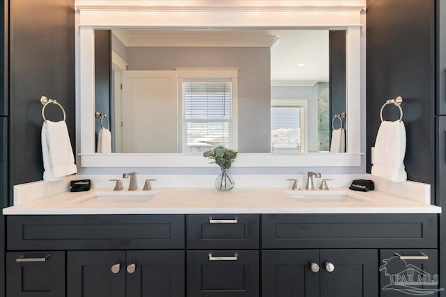 bathroom featuring vanity and crown molding