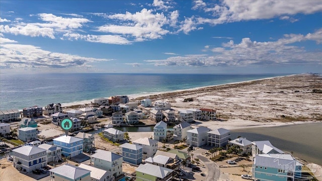 bird's eye view featuring a water view and a beach view