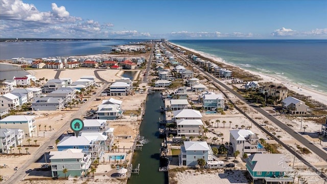 birds eye view of property featuring a view of the beach and a water view