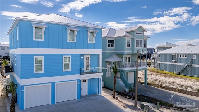 view of front of home with central AC and a garage