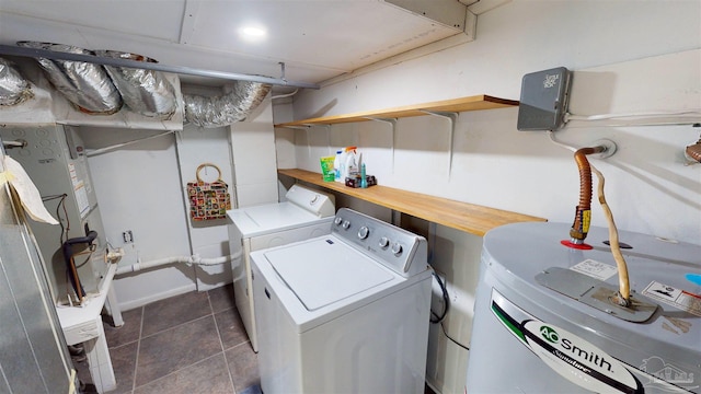 clothes washing area with washing machine and dryer