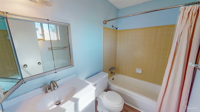 full bathroom featuring toilet, vanity, and shower / tub combo with curtain