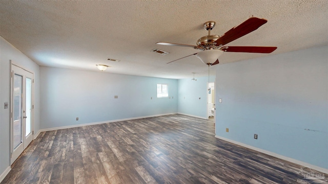 empty room featuring a textured ceiling, dark wood-type flooring, and ceiling fan