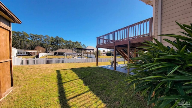 view of yard featuring a deck and a patio area