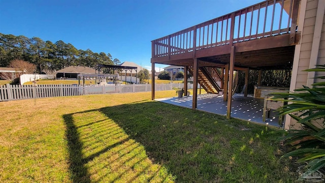 view of yard featuring a pergola, a patio area, and a wooden deck