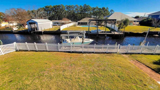 view of dock featuring a water view, a lawn, and a pergola