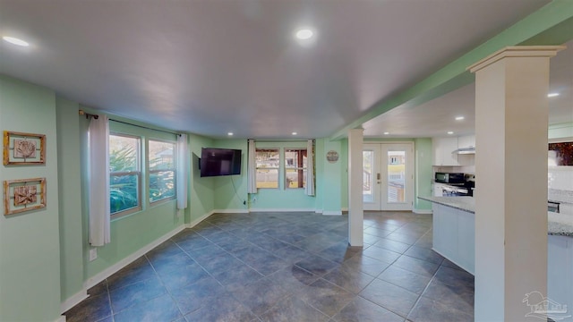 unfurnished living room with french doors