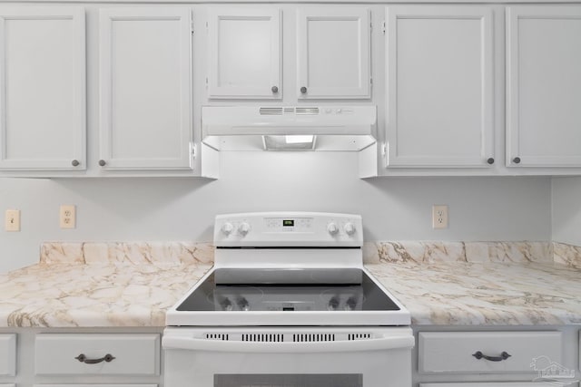 kitchen featuring light countertops, electric stove, white cabinets, and under cabinet range hood