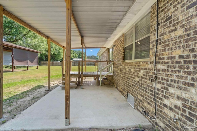 view of patio featuring fence