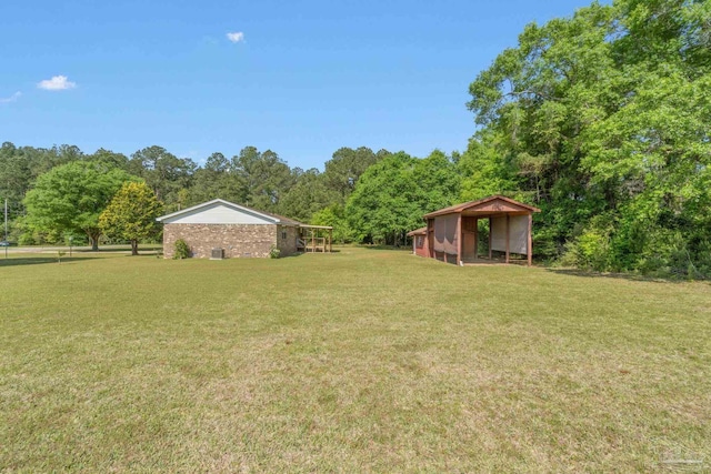 view of yard with a wooded view