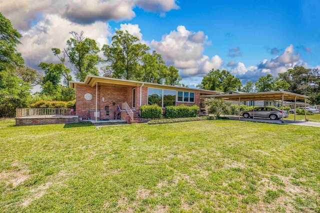 view of front of property with brick siding and a front yard