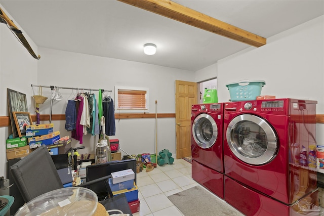laundry room with washing machine and dryer and tile patterned floors