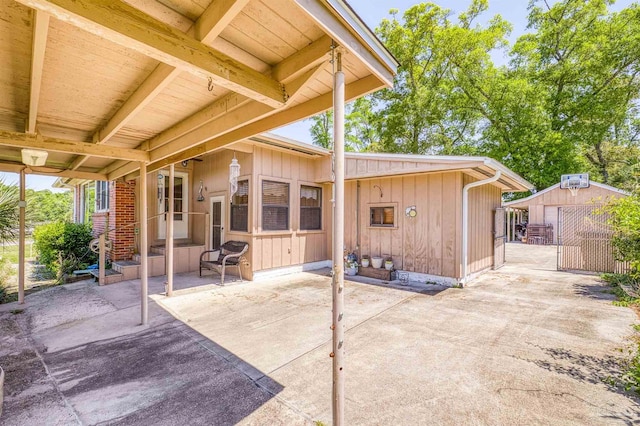 view of patio with an outbuilding