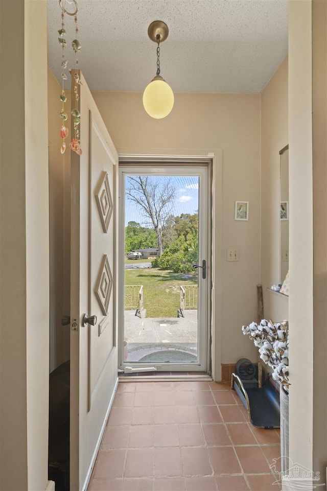 doorway with a textured ceiling