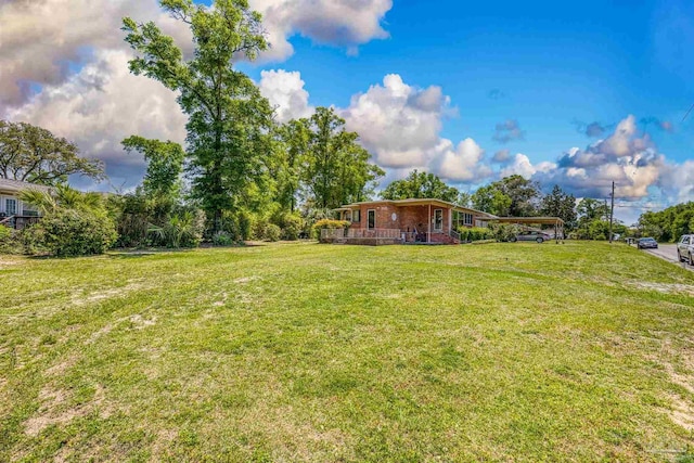 view of yard with a carport
