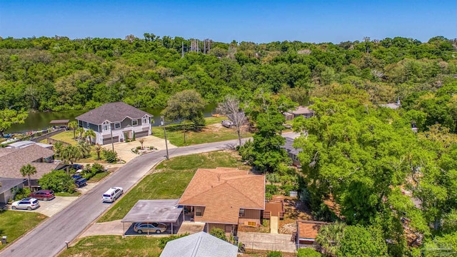 birds eye view of property with a wooded view