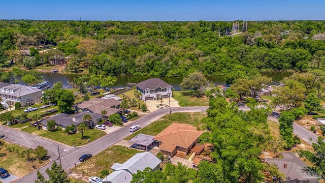 bird's eye view featuring a view of trees, a water view, and a residential view