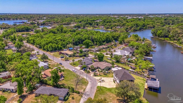 drone / aerial view featuring a water view and a residential view