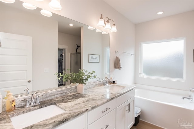 1928 Appleton Dr, Cantonment, FL 32533 - full bathroom featuring a bath, double vanity, and recessed lighting