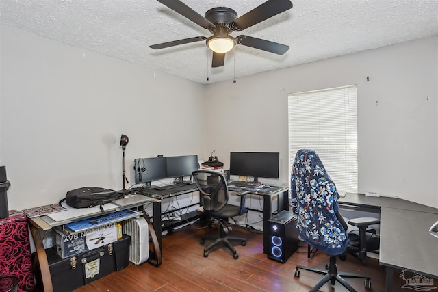 office space with a ceiling fan, wood finished floors, and a textured ceiling