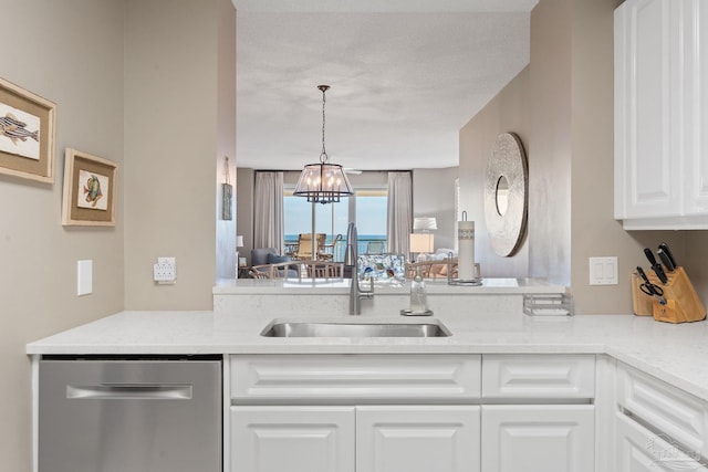 kitchen featuring sink, dishwasher, light stone countertops, white cabinets, and decorative light fixtures