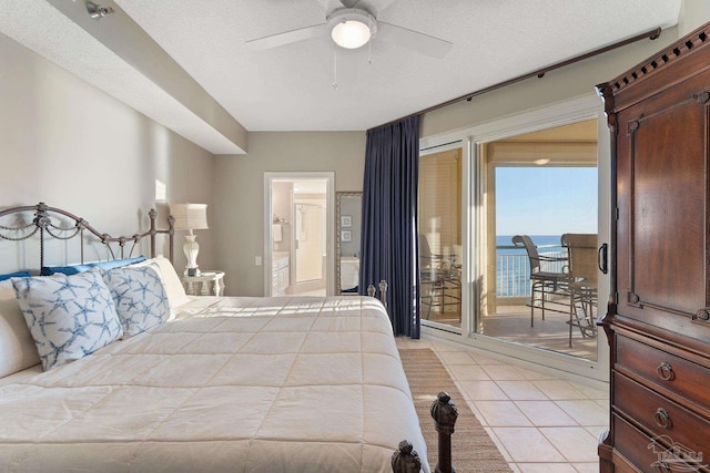 tiled bedroom with a water view, ceiling fan, a textured ceiling, and access to outside