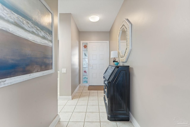 doorway to outside featuring light tile patterned floors