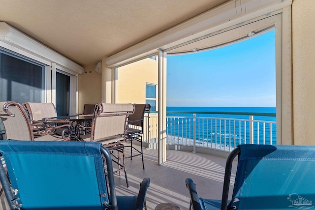 balcony featuring a water view