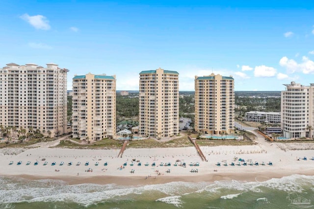 bird's eye view featuring a beach view and a water view