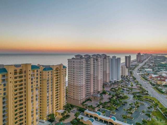 aerial view at dusk with a water view