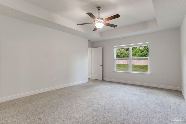1825 Peace Ter, Cantonment, FL 32533 - carpeted empty room featuring a raised ceiling, a ceiling fan, and baseboards