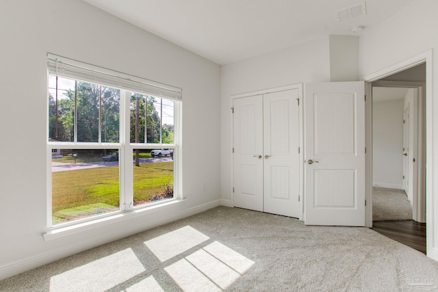 1825 Peace Ter, Cantonment, FL 32533 - unfurnished bedroom featuring baseboards, carpet flooring, visible vents, and a closet