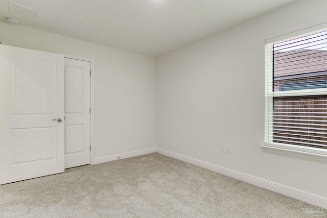 1825 Peace Ter, Cantonment, FL 32533 - carpeted empty room featuring a wealth of natural light, visible vents, and baseboards