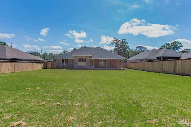 1825 Peace Ter, Cantonment, FL 32533 - back of house featuring a fenced backyard and a lawn