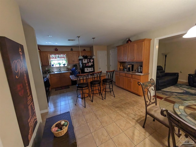 dining room with sink and light tile patterned flooring