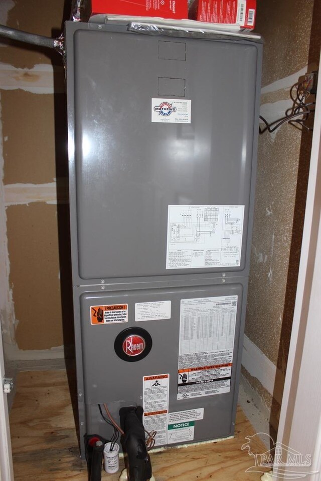 utility room with heating unit