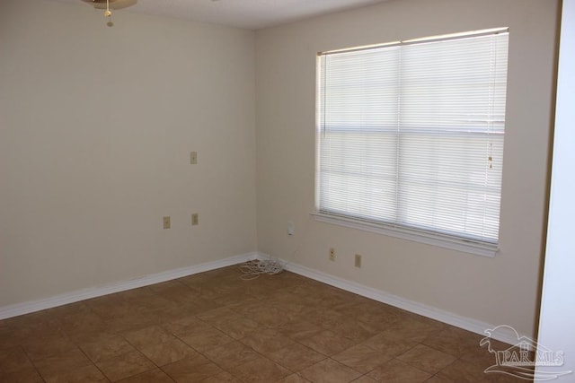 spare room featuring ceiling fan