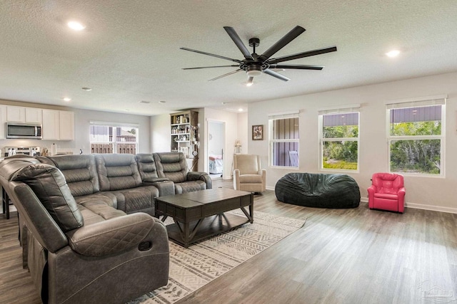 10869 Blacktail Loop, Pensacola, FL 32526 - living area featuring a textured ceiling, a ceiling fan, wood finished floors, recessed lighting, and baseboards