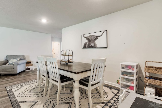 10869 Blacktail Loop, Pensacola, FL 32526 - dining room featuring wood finished floors and baseboards