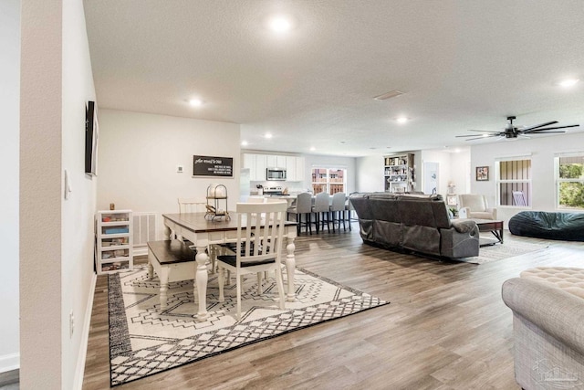 10869 Blacktail Loop, Pensacola, FL 32526 - dining room featuring light wood-style floors, recessed lighting, a textured ceiling, and ceiling fan