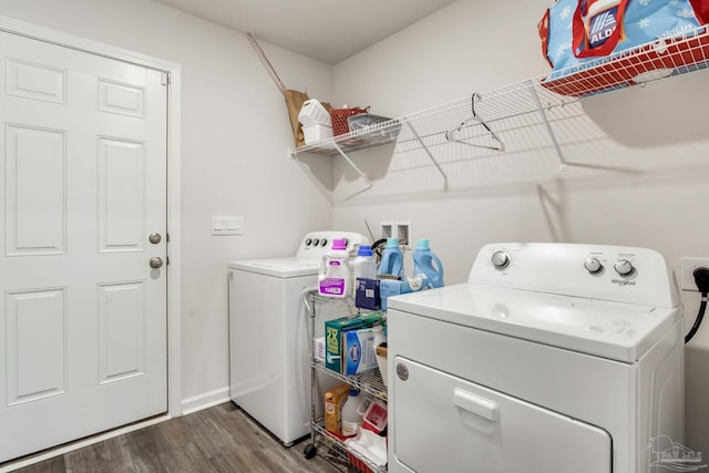 10869 Blacktail Loop, Pensacola, FL 32526 - laundry area featuring washer and clothes dryer, dark wood-style flooring, and baseboards
