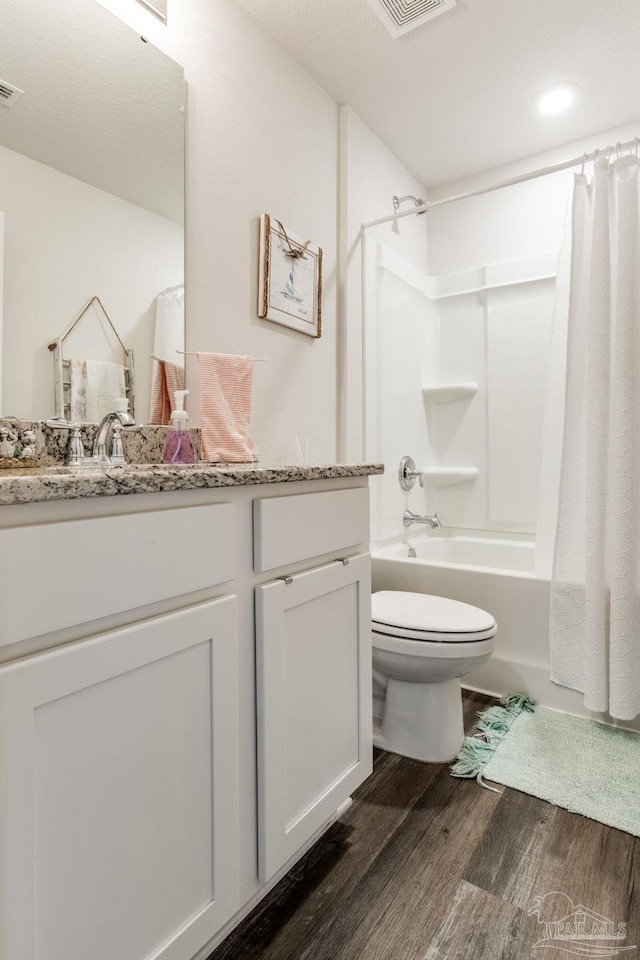 10869 Blacktail Loop, Pensacola, FL 32526 - bathroom with wood finished floors, toilet, shower / bath combo, and vanity