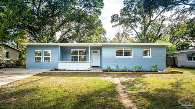 ranch-style house with a front lawn