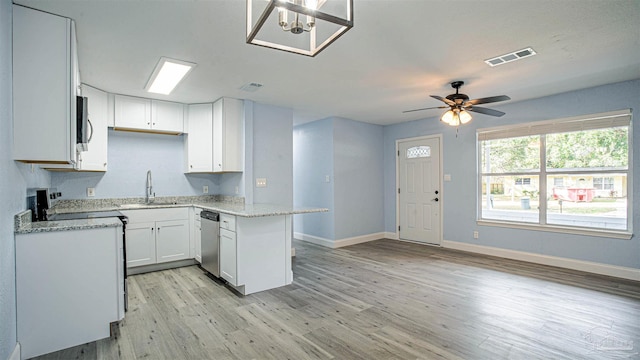 kitchen featuring sink, light wood-type flooring, white cabinetry, kitchen peninsula, and stainless steel appliances